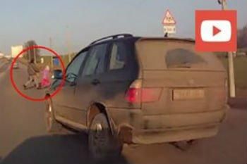 Видеофакт. ГАИ заинтересовалась видео, на котором водитель BMW Х5 едва не сбил мужчину с ребенком