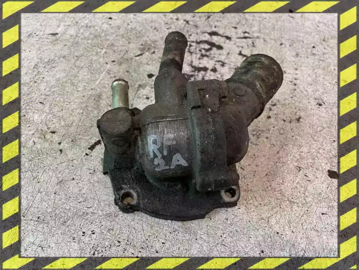 Корпус термостата к Mazda 626 2000