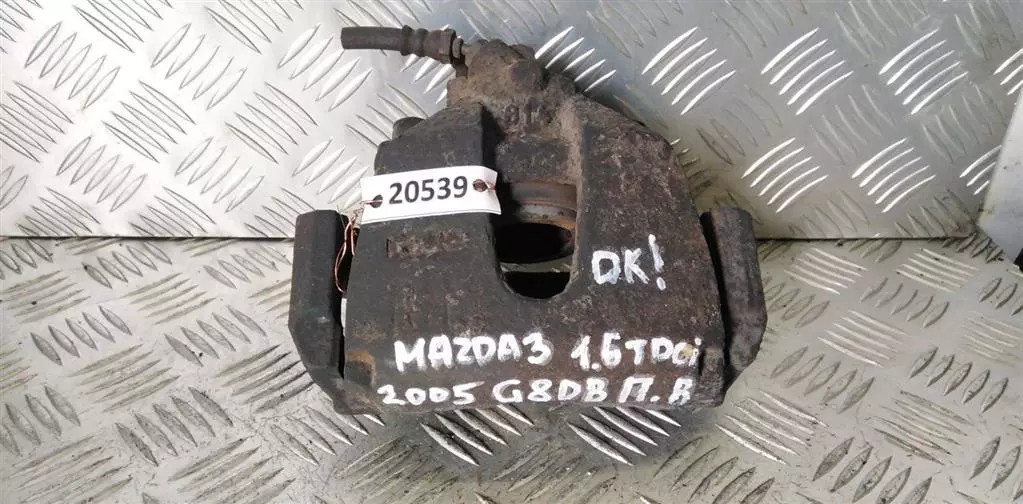 Суппорт передний правый к Mazda 3 2005