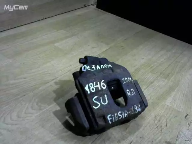 Суппорт передний левый к Ford Fiesta 2000