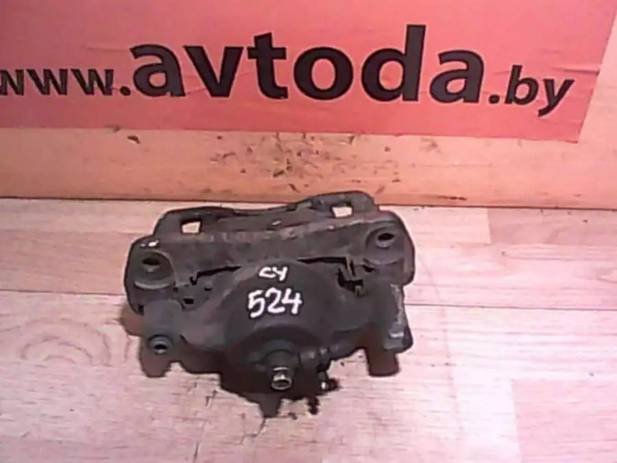 Суппорт передний левый к Mazda 626 1997