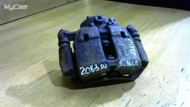 Суппорт передний левый к Mitsubishi Colt 2004