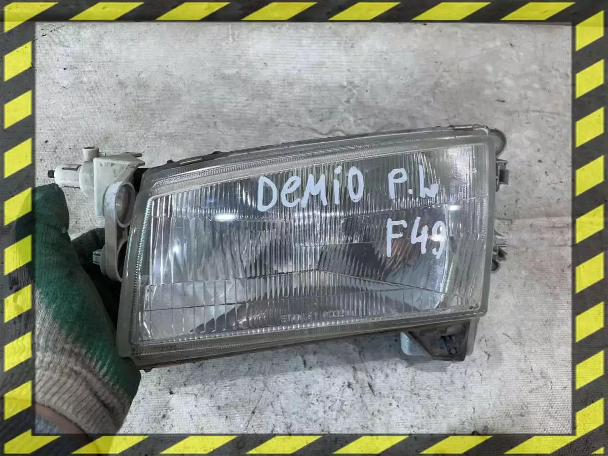 Фара левая к Mazda Demio 1998