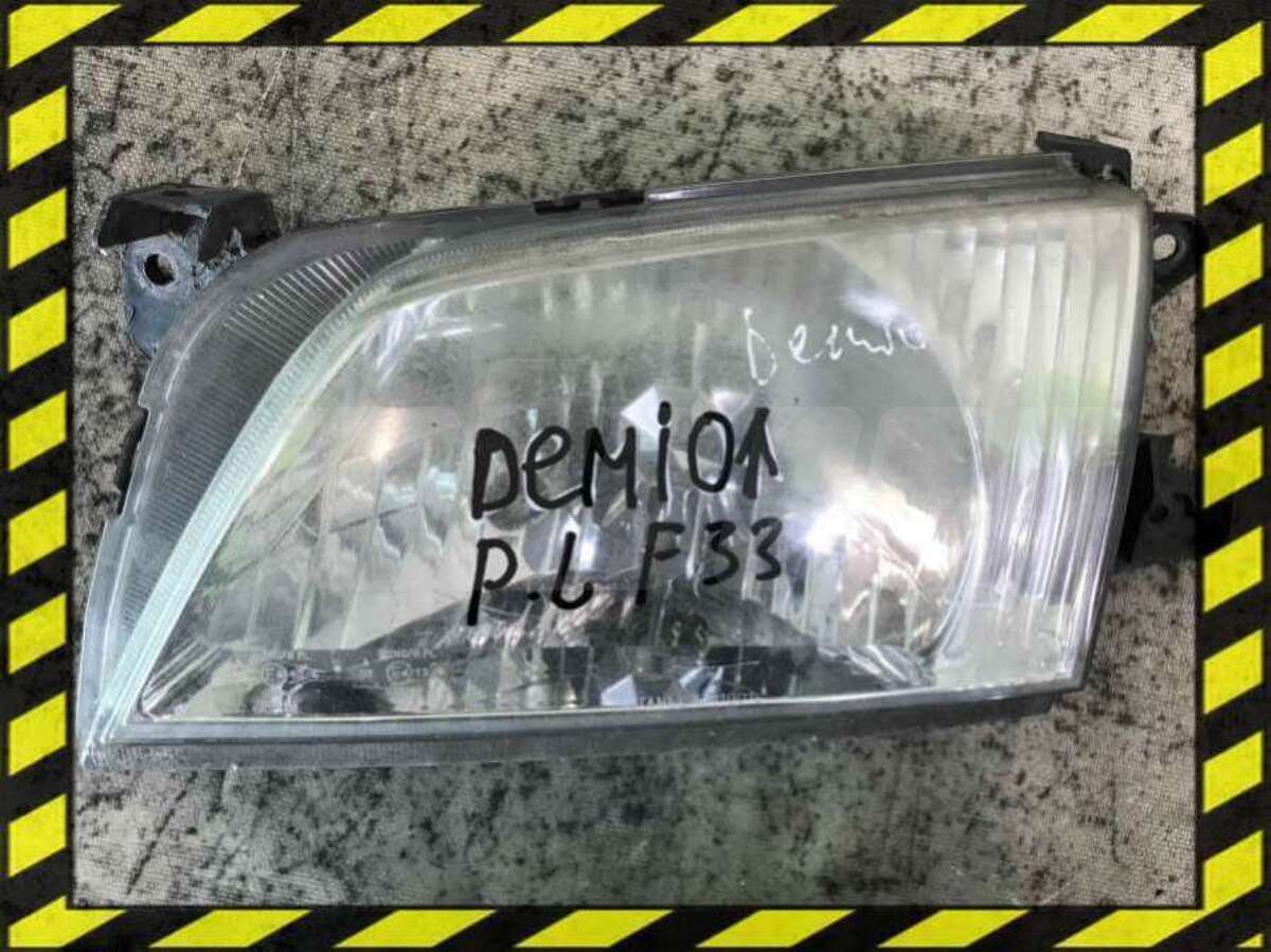 Фара левая к Mazda Demio 2000