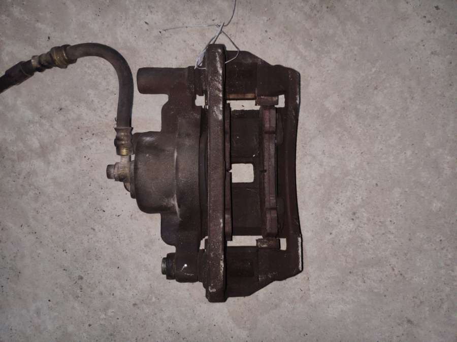 Суппорт передний правый к Mazda 323 2001