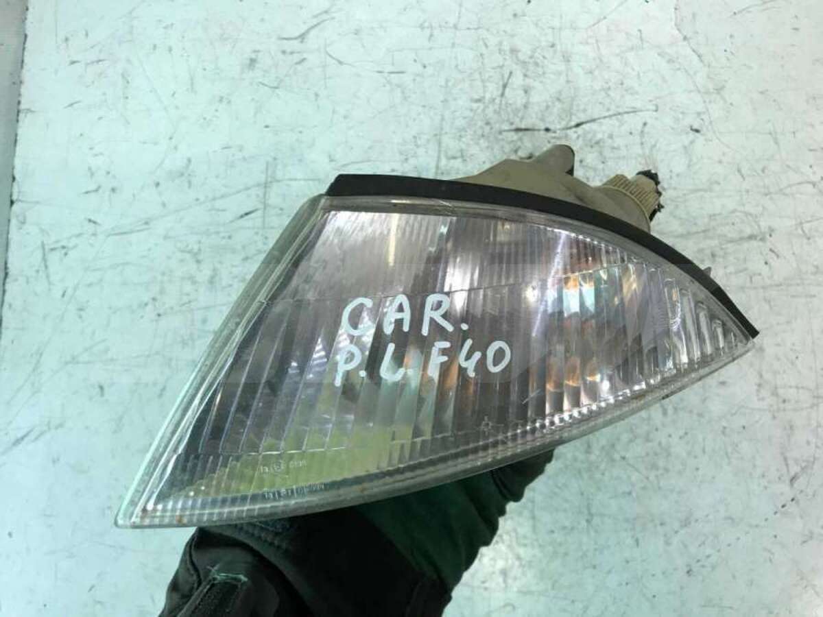 Поворотник левый к Mitsubishi Carisma 1997