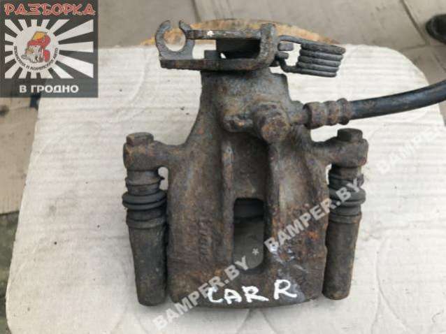 Суппорт задний левый к Mitsubishi Carisma 1999
