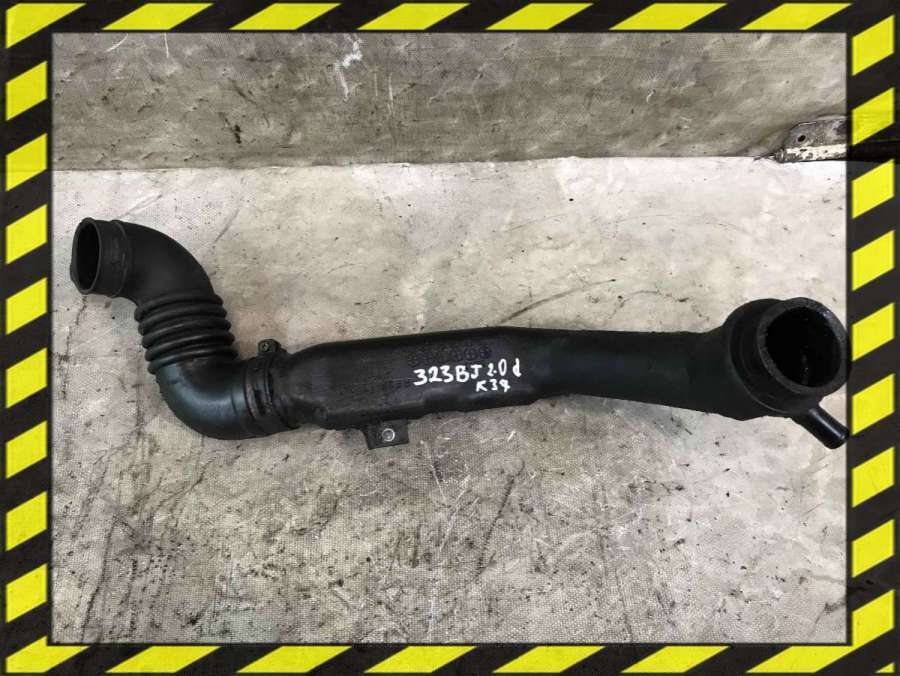 Патрубок турбины к Mazda 323 1999