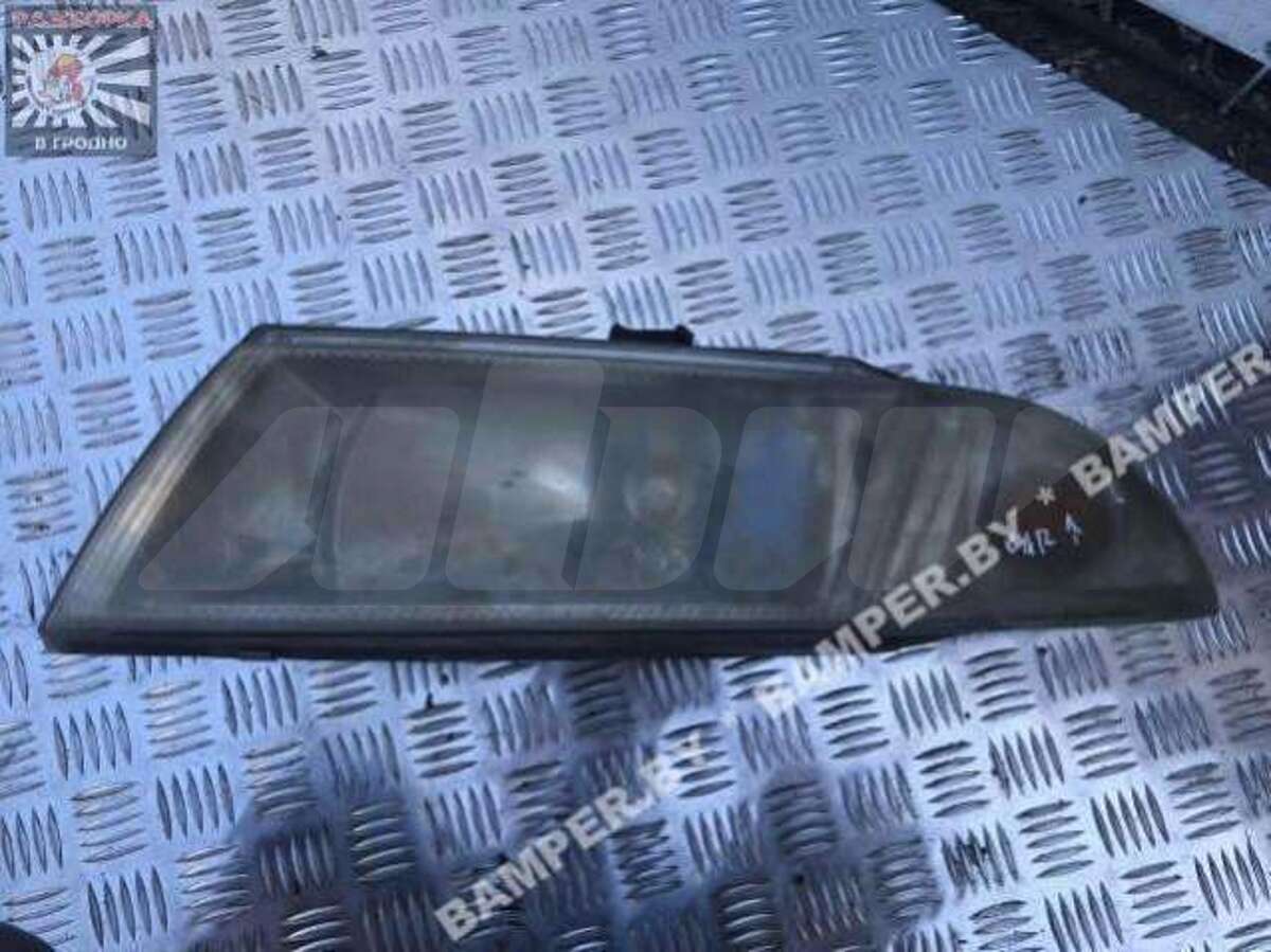 Фара левая к Mitsubishi Carisma 2000