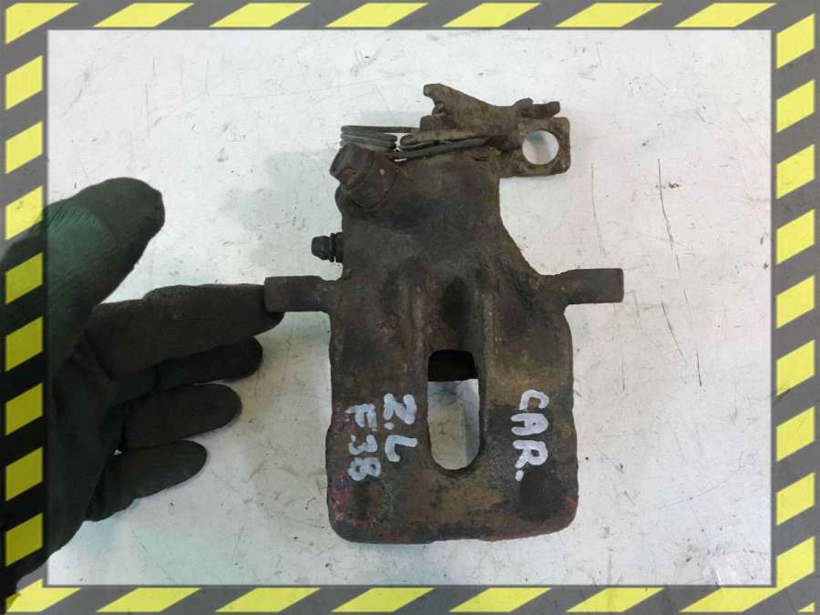 Суппорт задний левый к Mitsubishi Carisma 1999