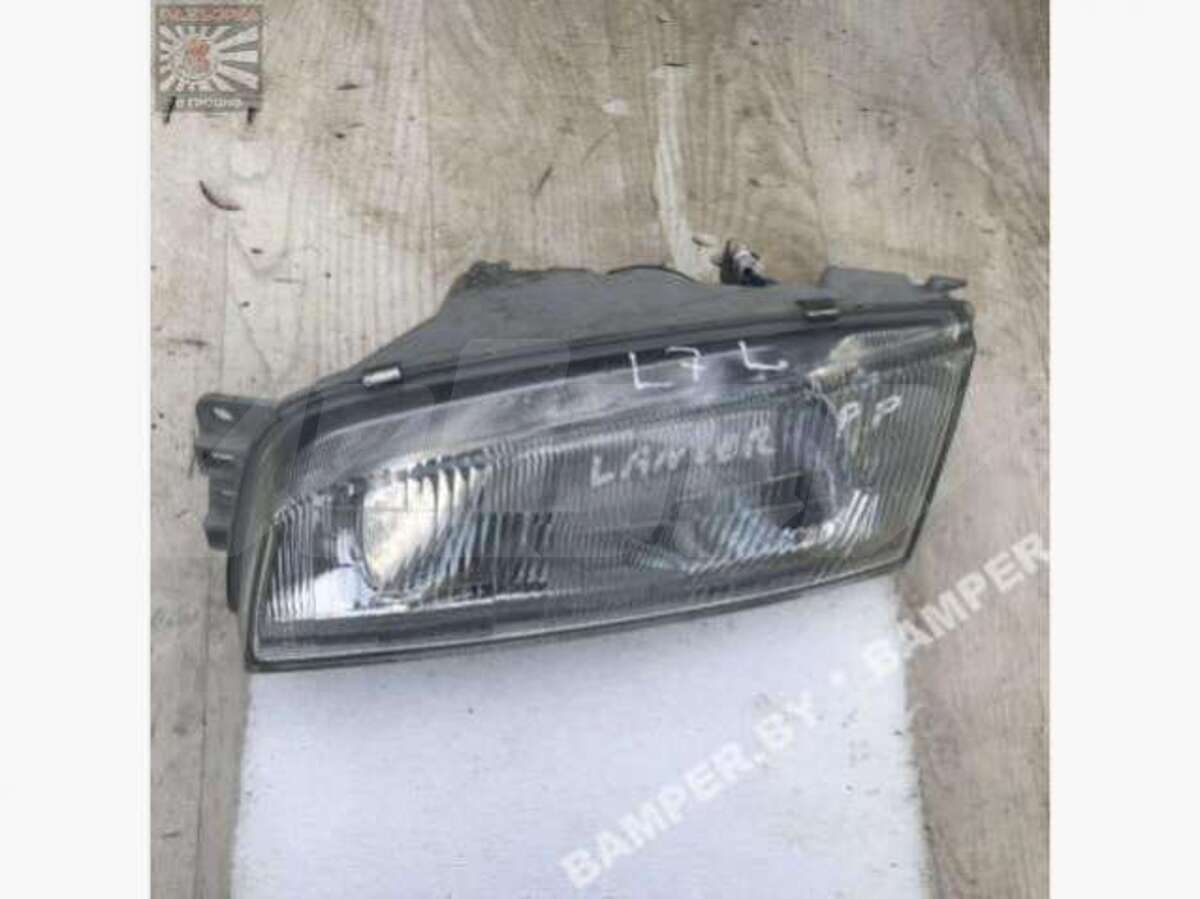 Фара левая к Mitsubishi Lancer 1998