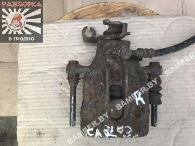 Суппорт задний левый к Mitsubishi Carisma 1999