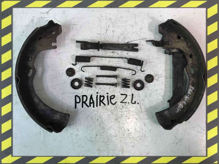 Механизм развода задних тормозных колодок левый к Nissan Prairie 1998