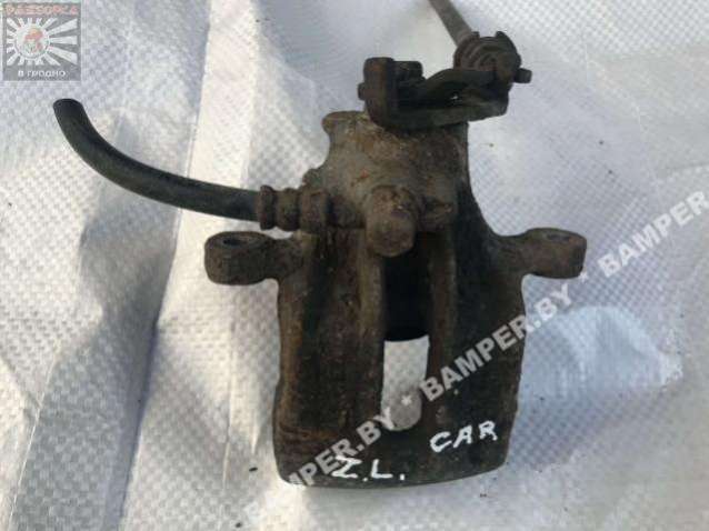 Суппорт задний левый к Mitsubishi Carisma 1998
