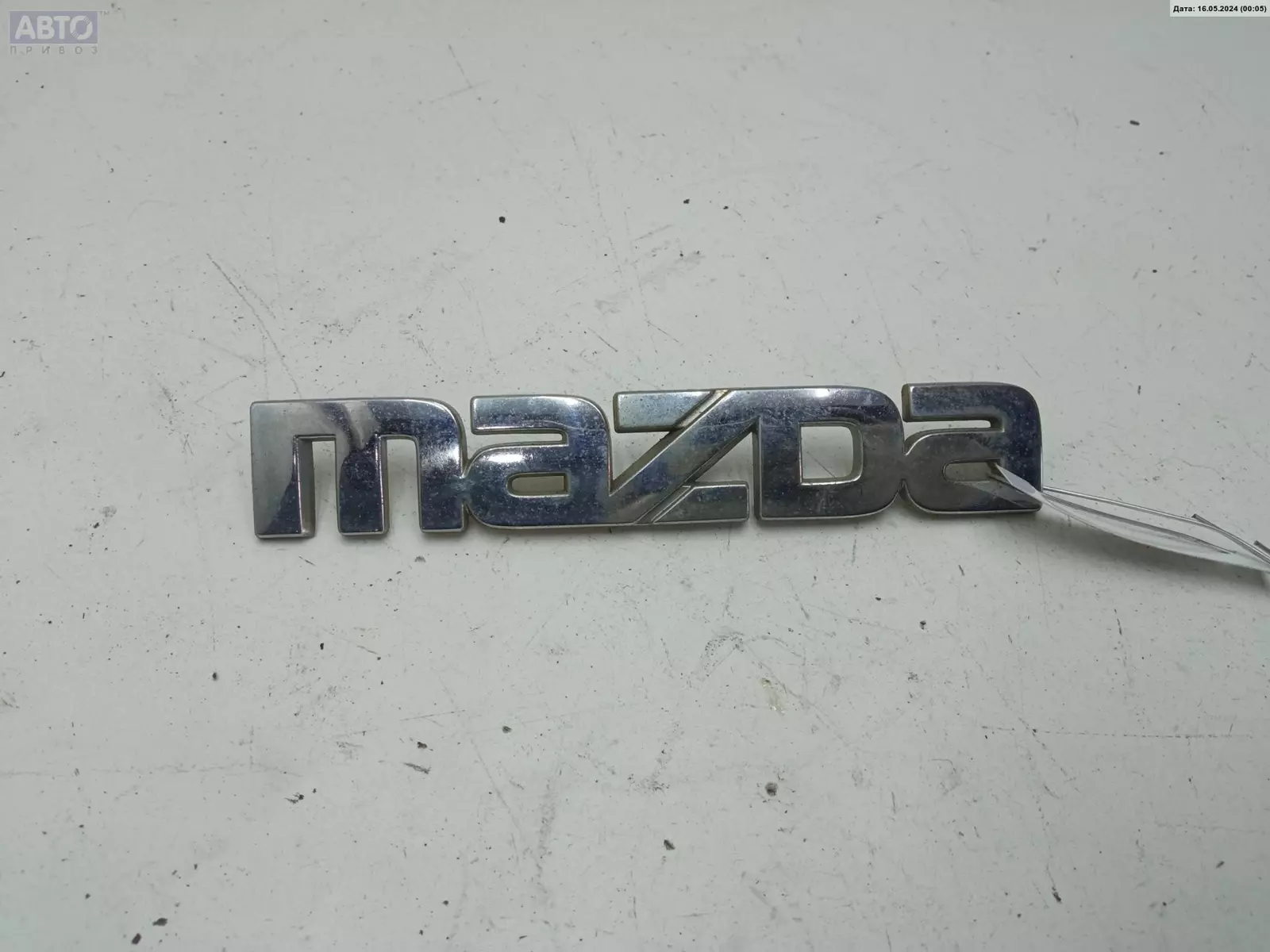 Эмблема к Mazda 626 1999