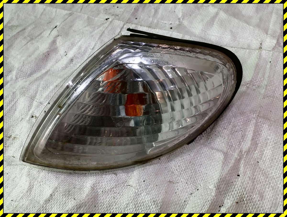 Поворотник левый к Nissan Almera 2001