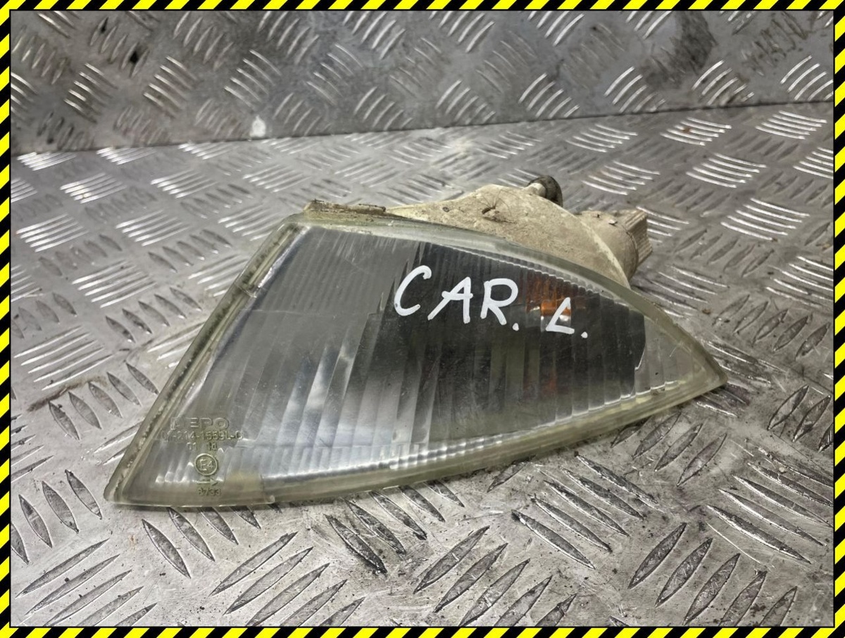 Поворотник левый к Mitsubishi Carisma 1999