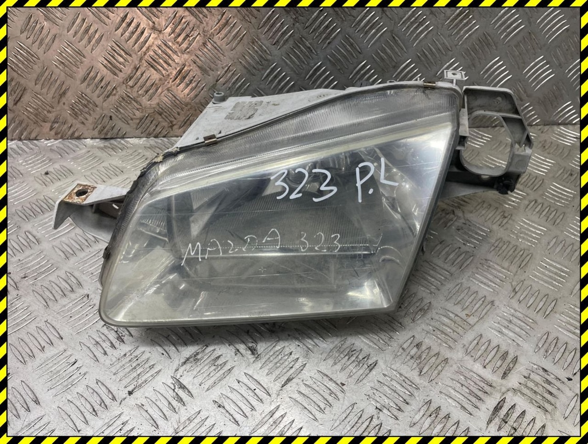 Фара левая к Mazda 323 1999