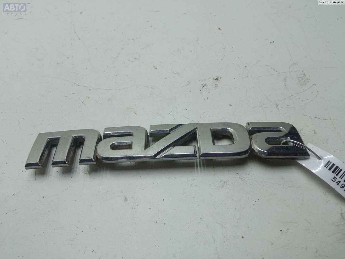 Эмблема к Mazda 2 2008