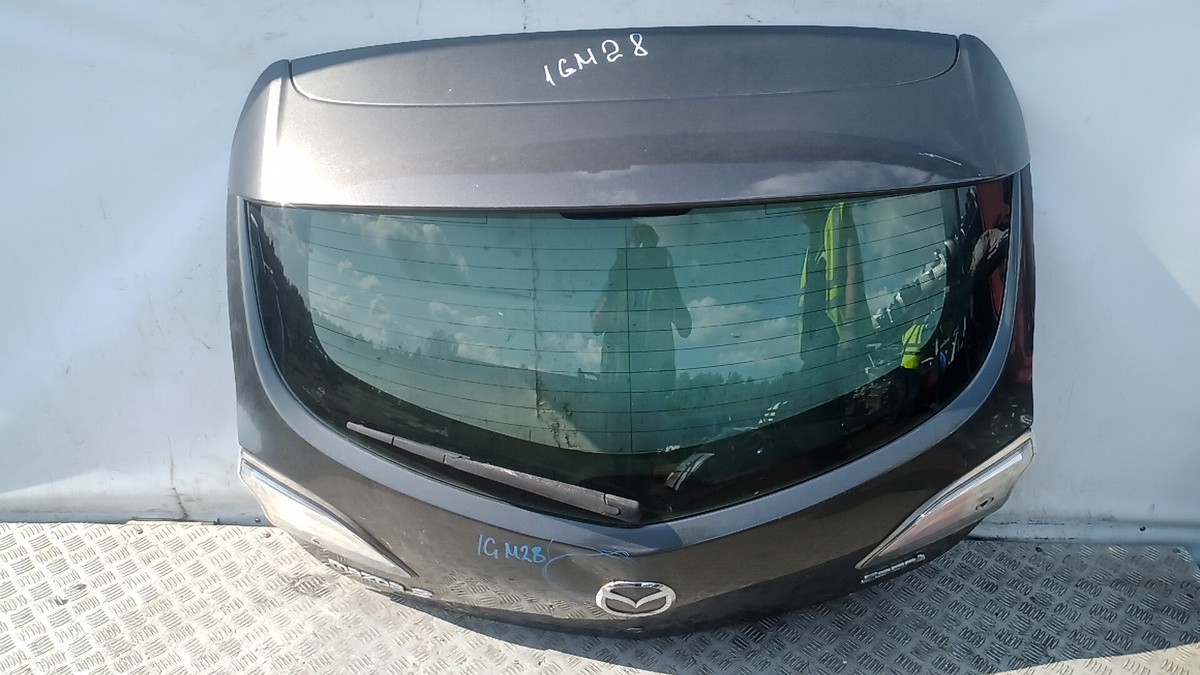 Замок двери к Mazda A3 2009