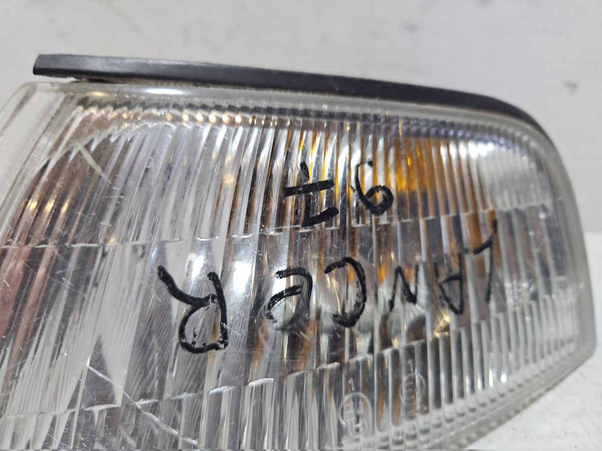 Поворотник левый к Mitsubishi Lancer 1997