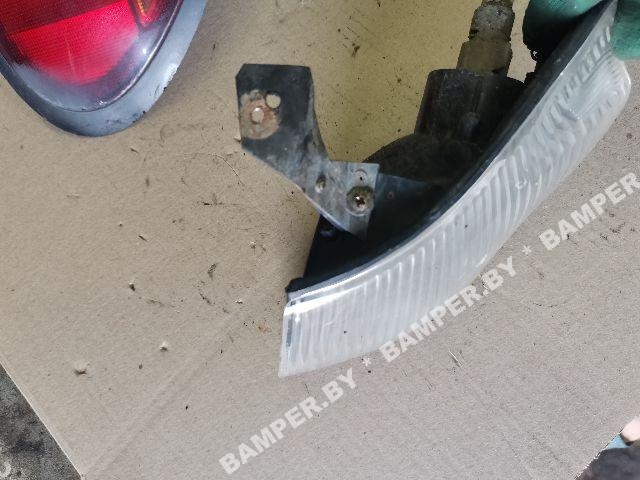 Поворотник левый к Mazda 323 1995