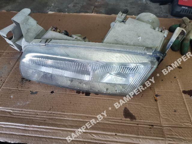Фара левая к Mazda 626 1995