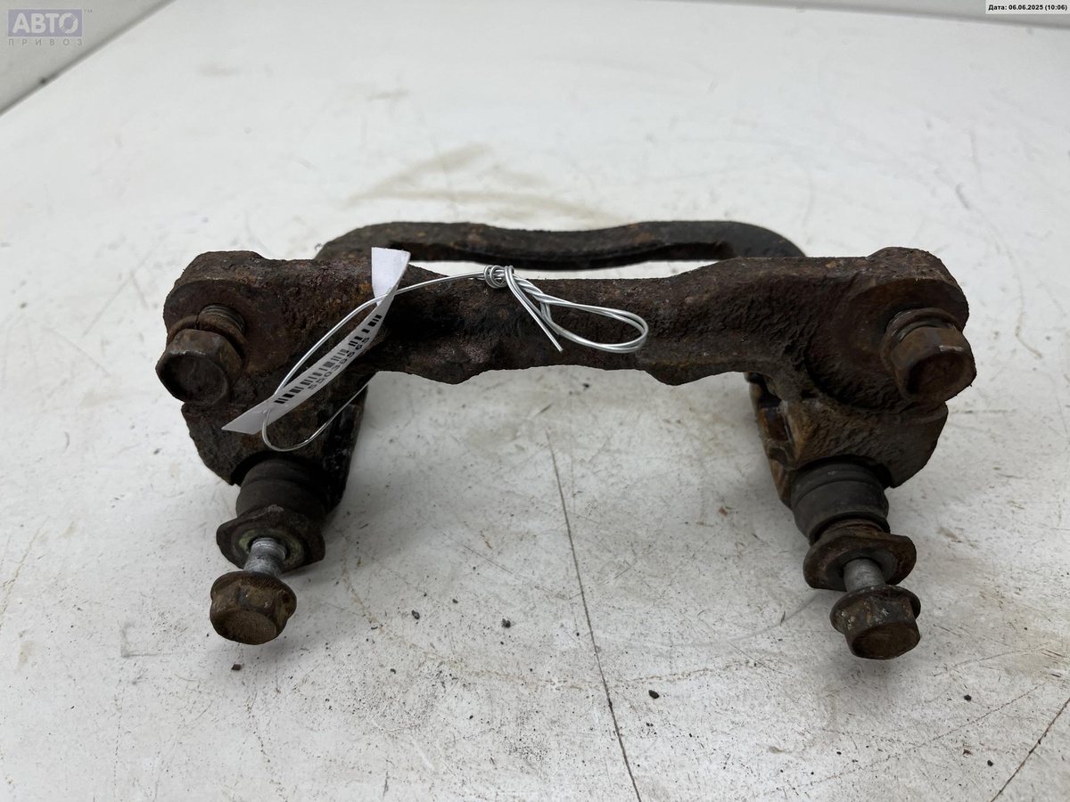 Скоба суппорта к Subaru Impreza 2001