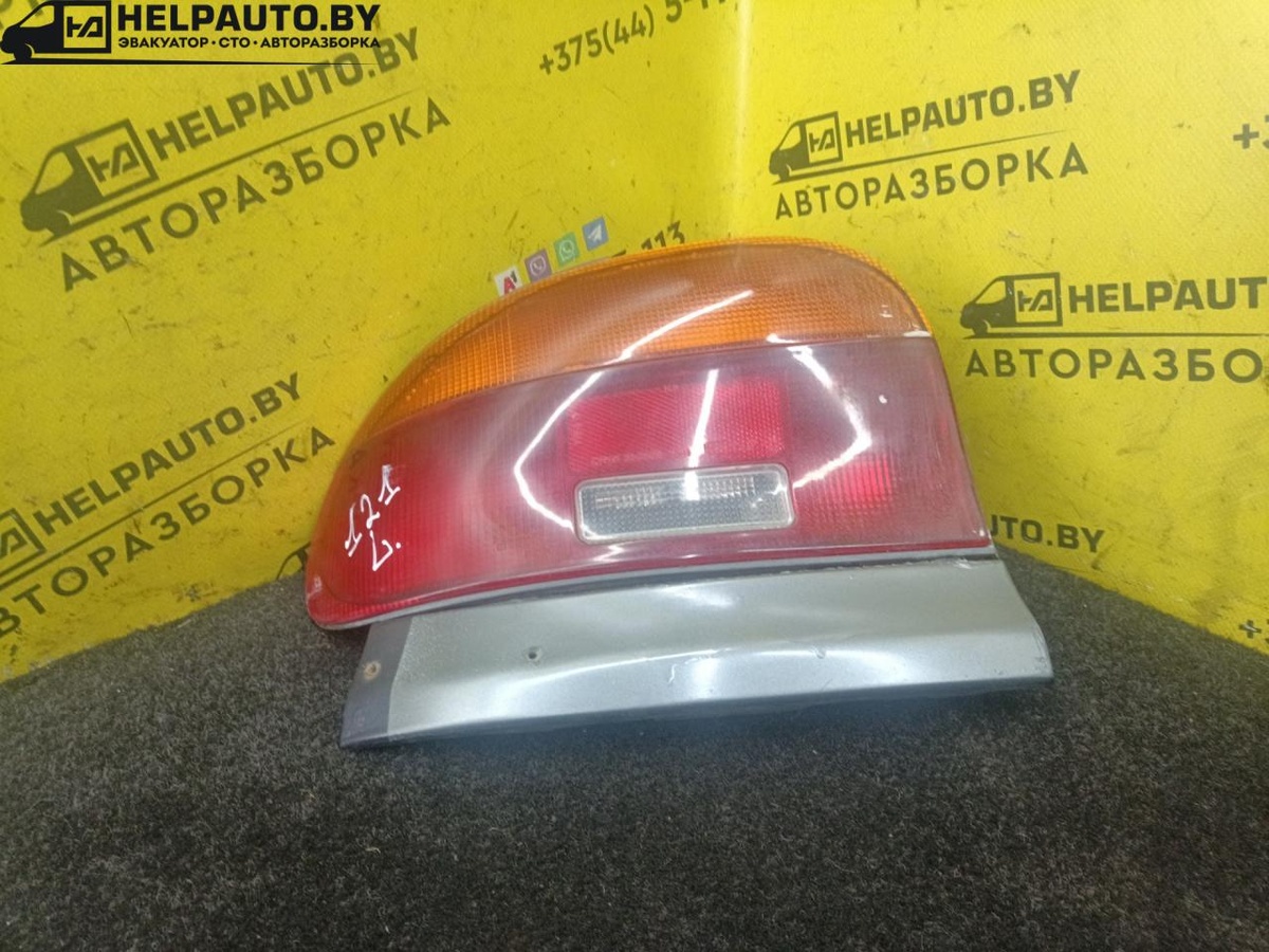 Фонарь задний левый к Mazda 121 1995