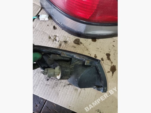 Поворотник левый к Mazda 626 1998