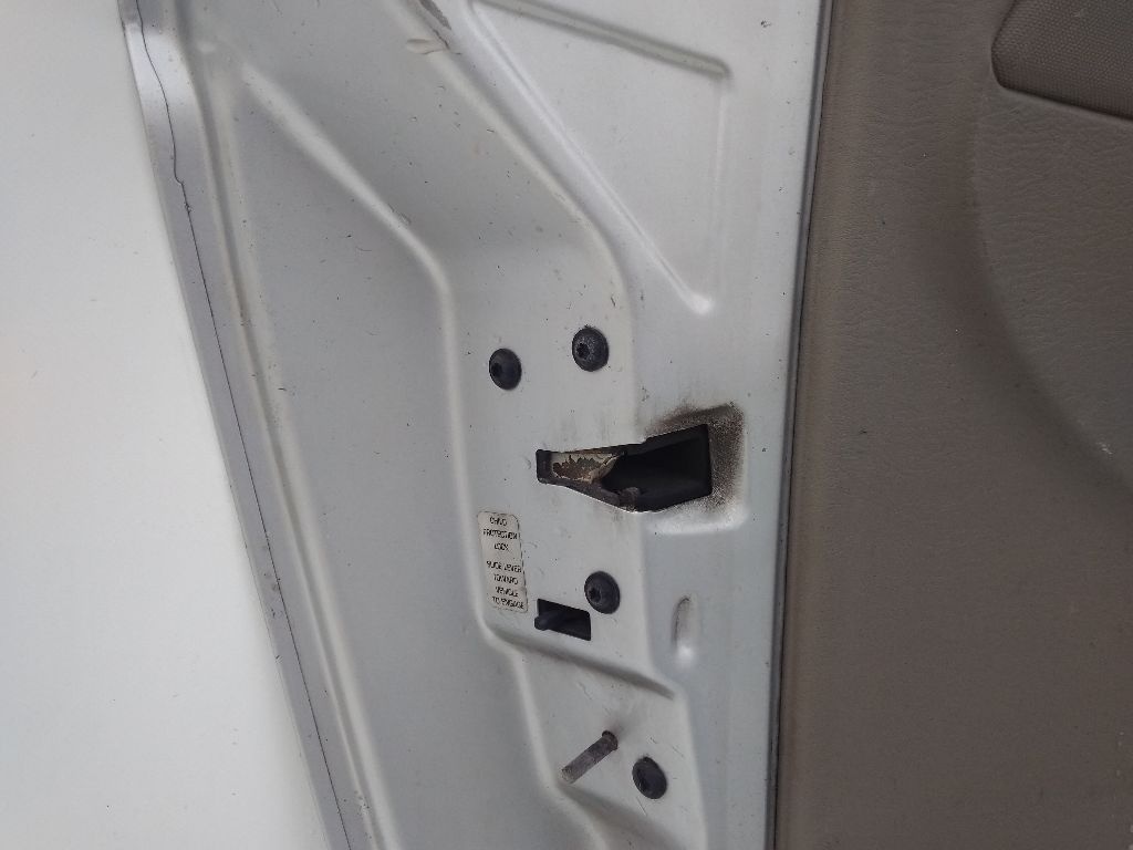 Замок двери к Dodge Caravan 2003