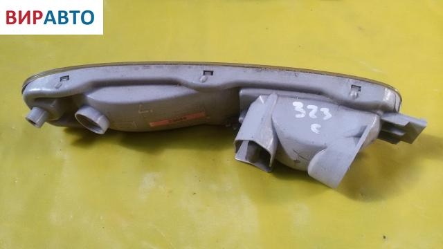 Поворотник левый к Mazda 323 1996