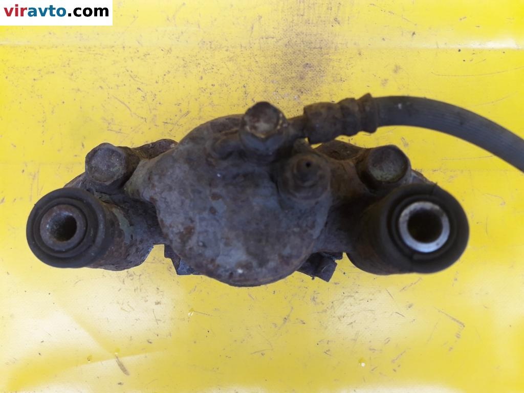 Суппорт передний правый к Mazda 323 1997