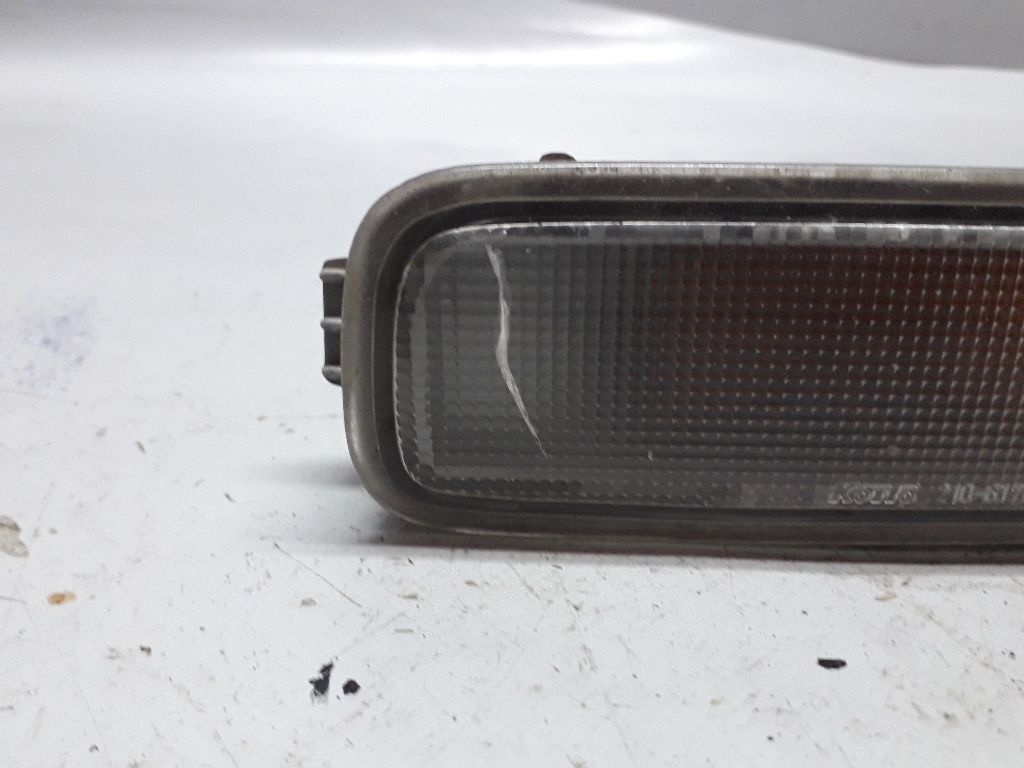 Поворотник левый к Mazda 323 1996