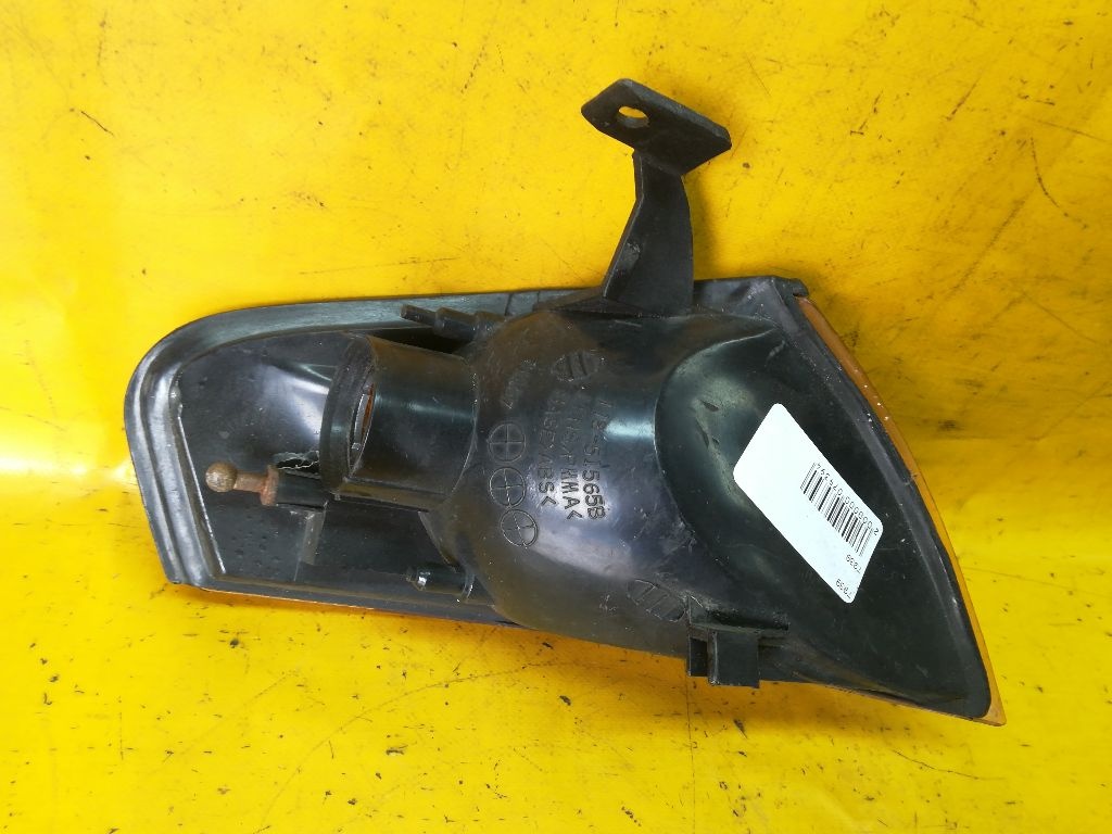 Поворотник левый к Mazda 323 1996