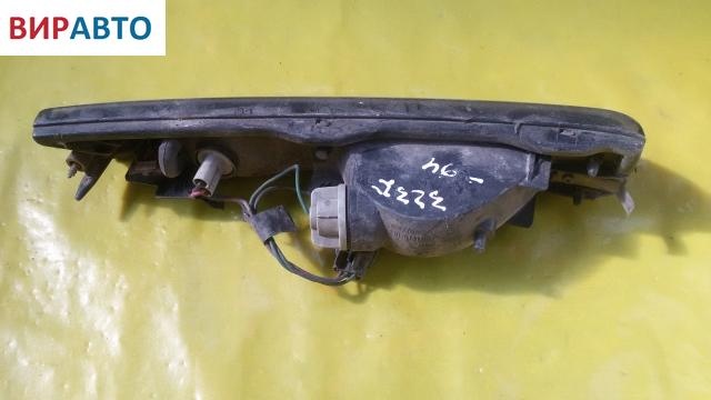 Поворотник левый к Mazda 323 1992