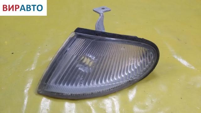 Поворотник левый к Mazda 323 1995