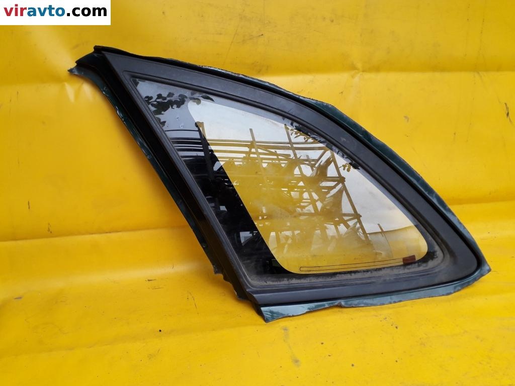 Стекло кузовное боковое левое  к Mazda 323 1999