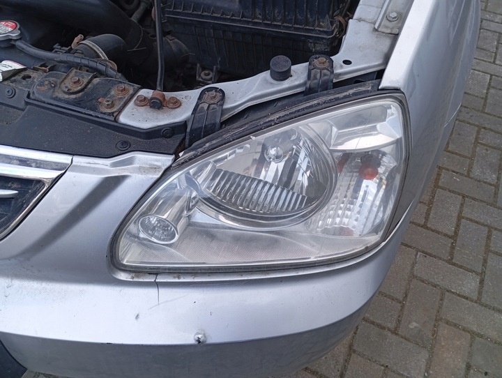 Фара левая к Kia Carens 2006