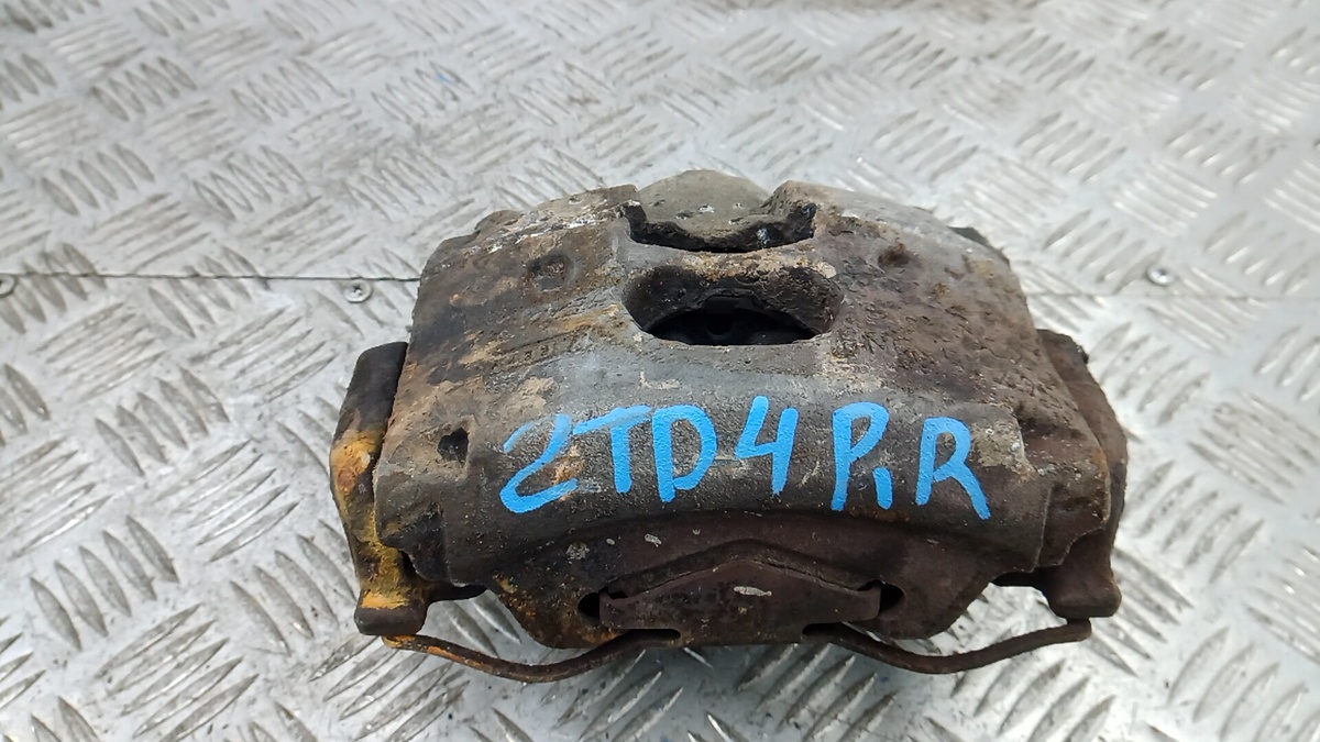 Скоба суппорта к Opel Vectra 2004