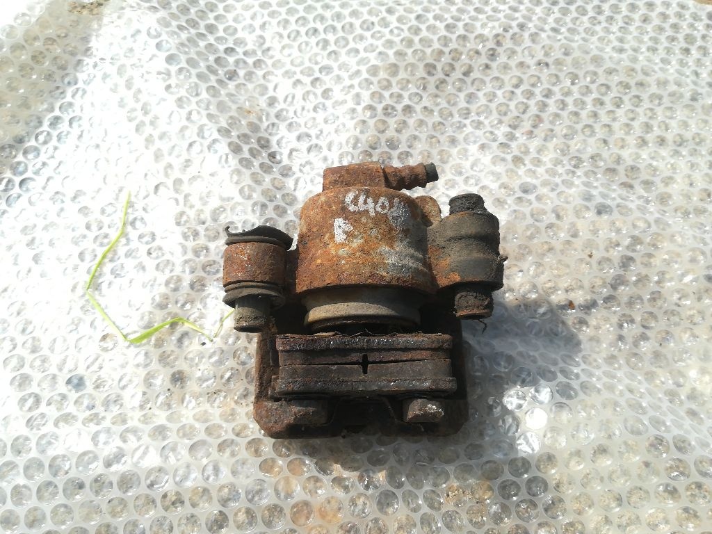 Суппорт передний правый к Daihatsu Cuore 1991