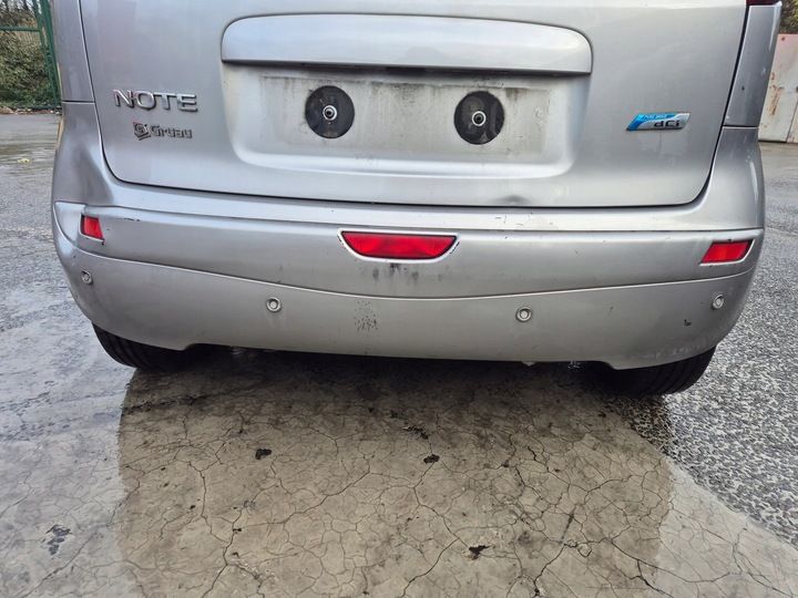 Бампер задний к Nissan Note 2009