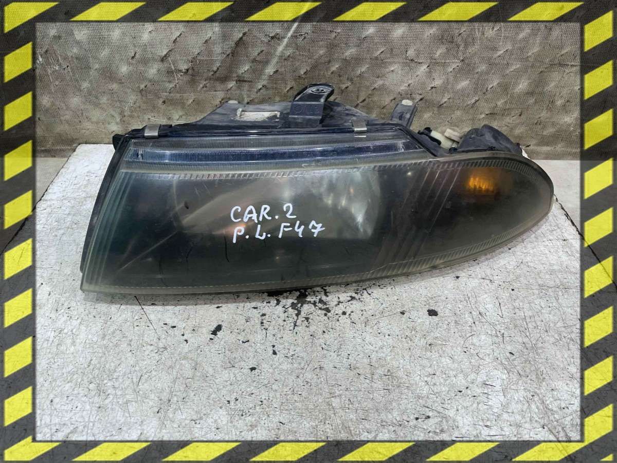 Фара левая к Mitsubishi Carisma 2001