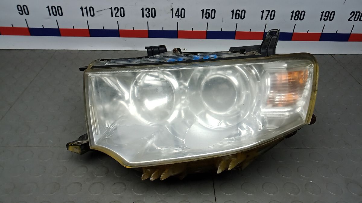 Фара левая к Mitsubishi L200 2011
