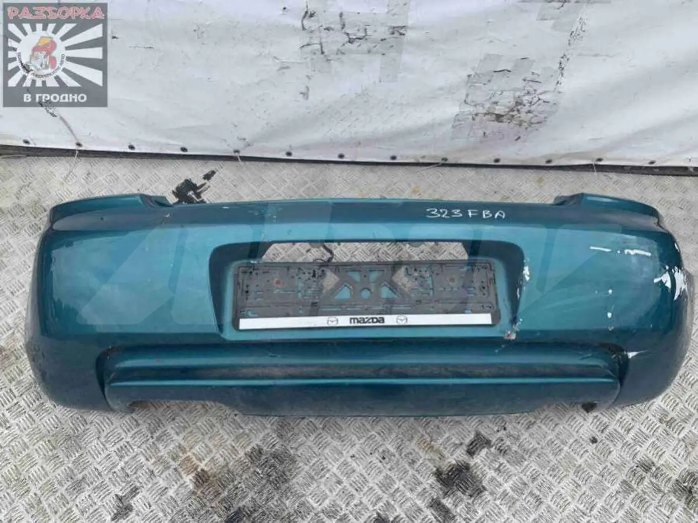 Бампер задний к Mazda 323 1996
