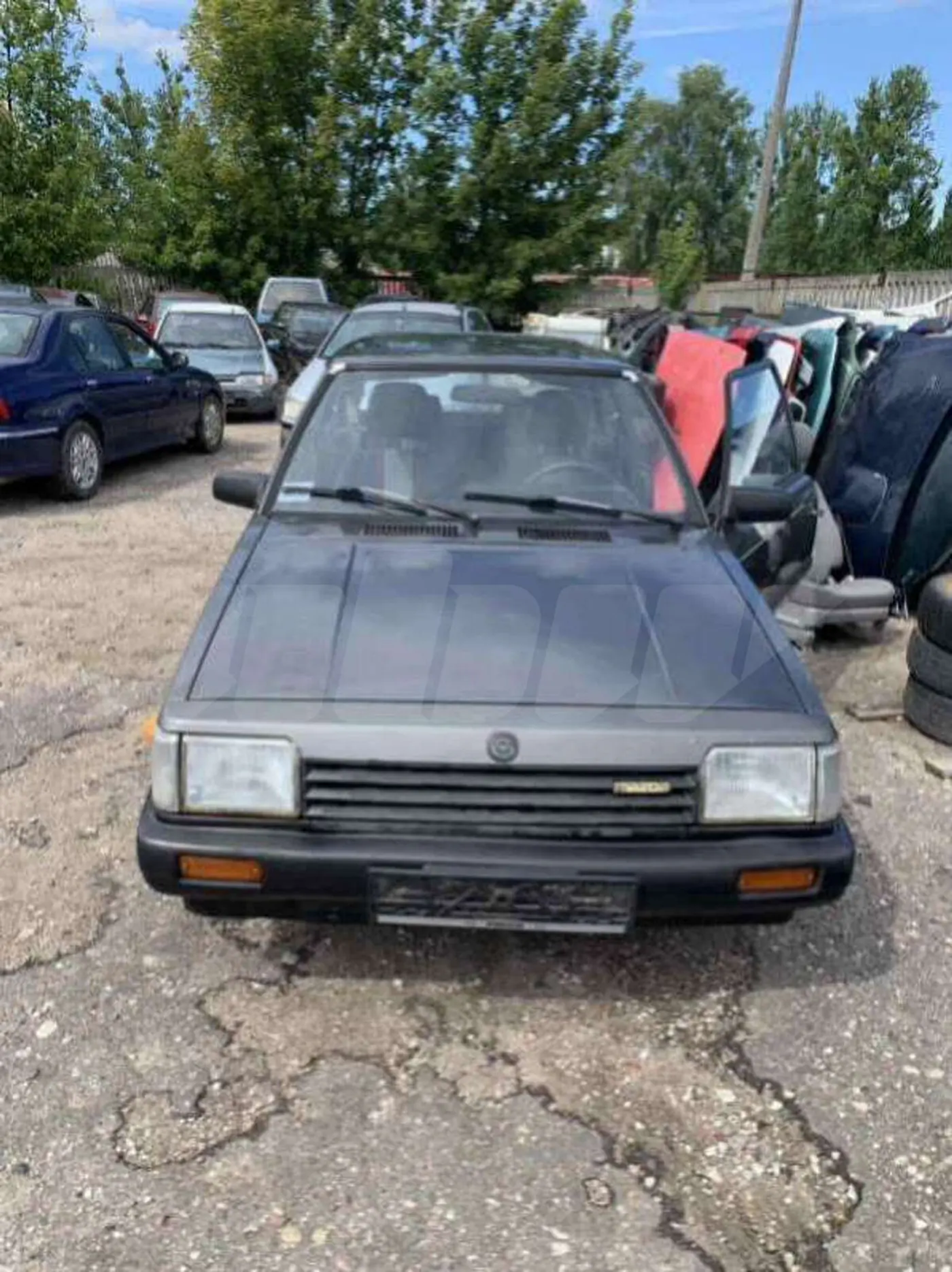 Бампер задний к Mazda 323 1982