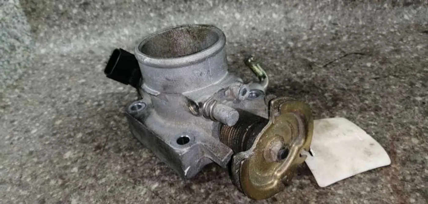 Заслонка дроссельная к Mazda Demio 2000