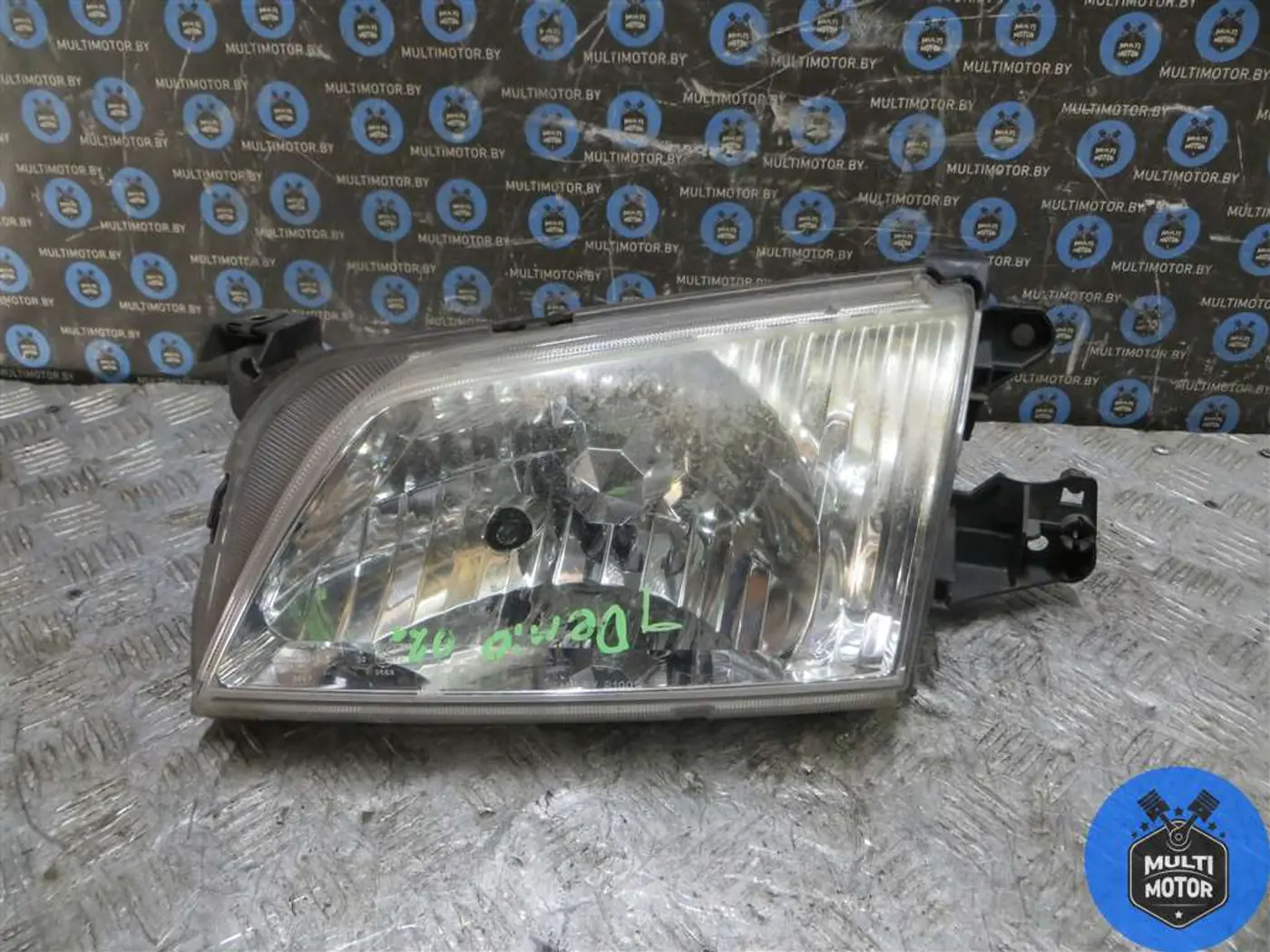 Фара левая к Mazda Demio 2002