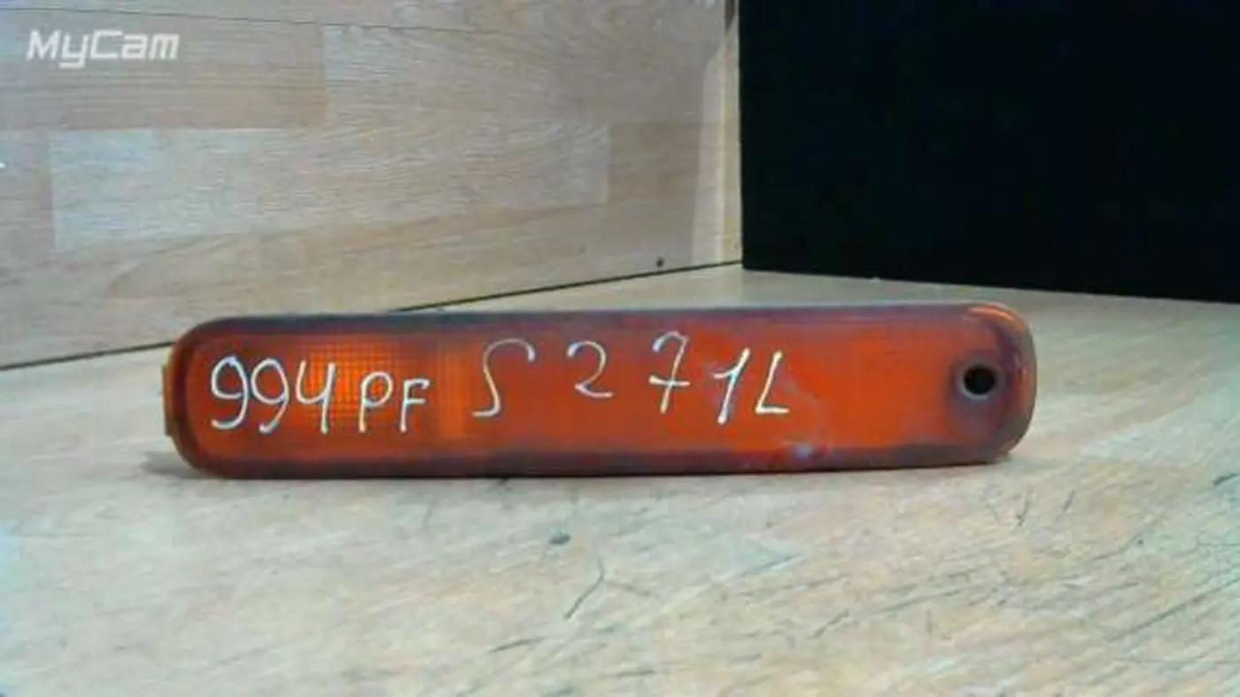 Поворотник левый к Mazda 323 1997
