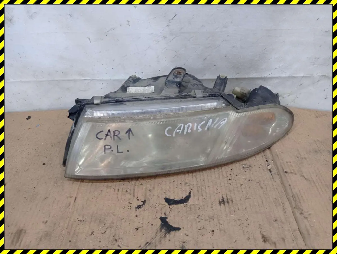 Фара левая к Mitsubishi Carisma 2003